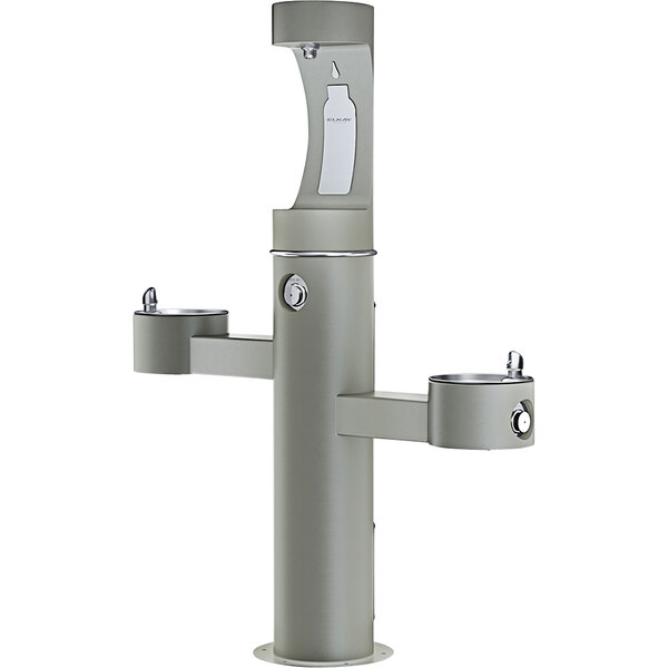 An Elkay gray outdoor tri-level pedestal drinking fountain with upper bottle filling station.