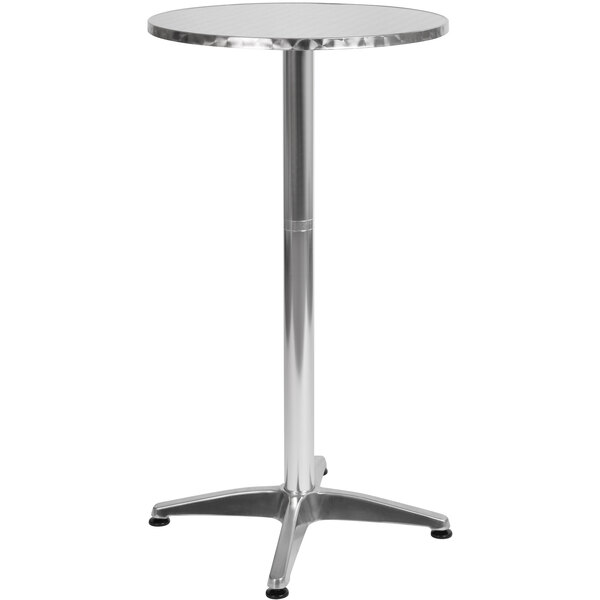 A Flash Furniture round silver metal bar table with a metal base.