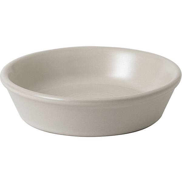A matte pearl stoneware dish with a small rim on a white background.