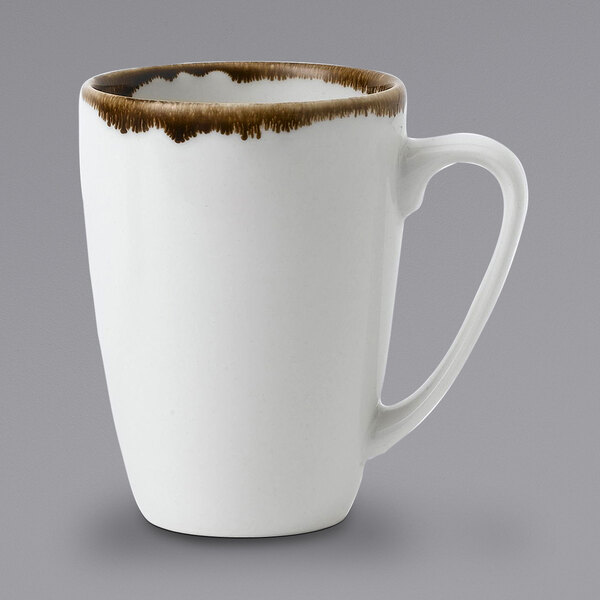 A white mug with brown rim.