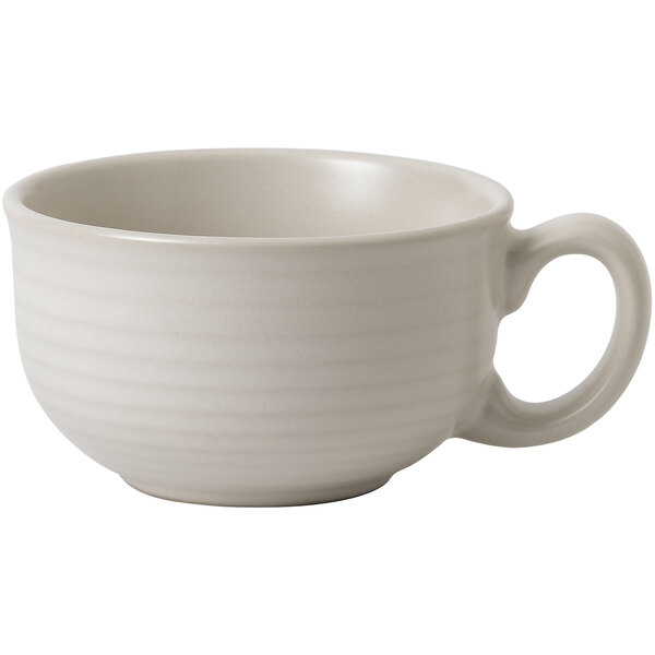 A close-up of a white Dudson Evo stoneware tea cup with a handle.