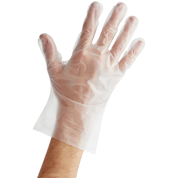 A person's hand wearing a clear plastic Noble TPE glove.