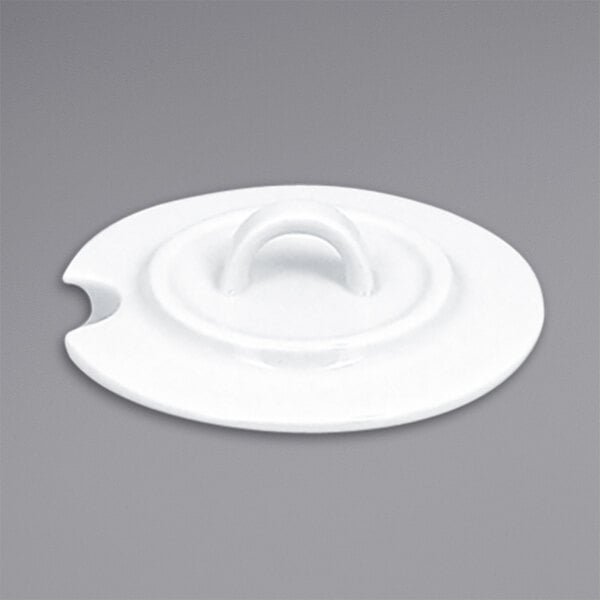 A white RAK Porcelain lid with a handle for a sugar bowl.