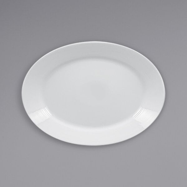 A white RAK Porcelain oval deep plate with a wide rim.