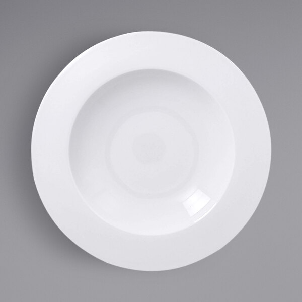 A white porcelain deep plate with a wide rim and a circle in the middle.