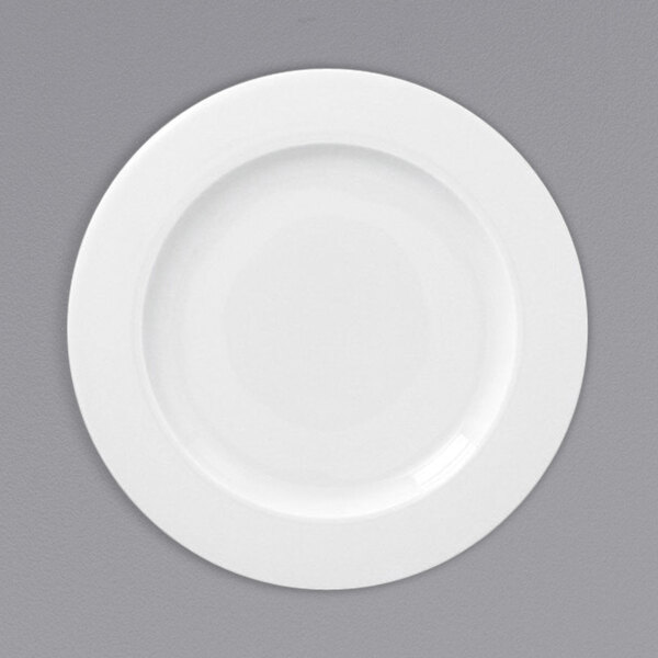 A white RAK Porcelain flat plate with a wide white rim.
