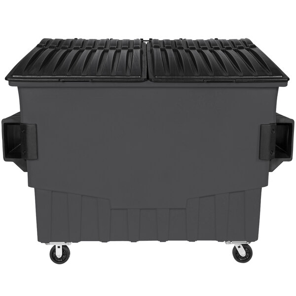 A large grey Toter dumpster with black lids and wheels.