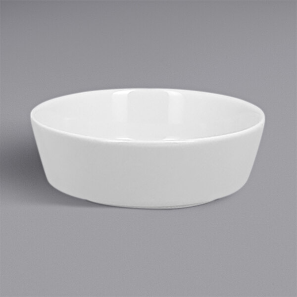 A RAK Porcelain white bowl on a grey background.