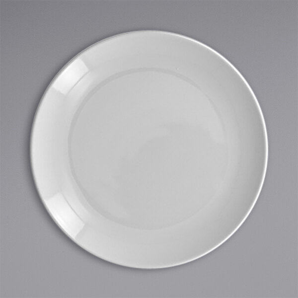A close-up of a RAK Porcelain white plate with a white rim.