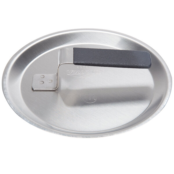 A Vollrath stainless steel pan cover with a Torogard handle.