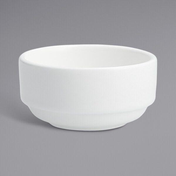 A Fortessa white porcelain round ramekin on a white background.