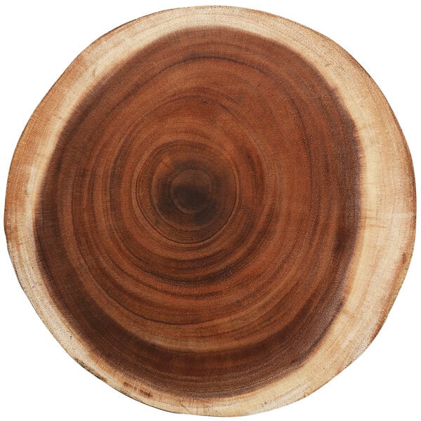 A Fortessa wood charger plate with a circular hole in it.