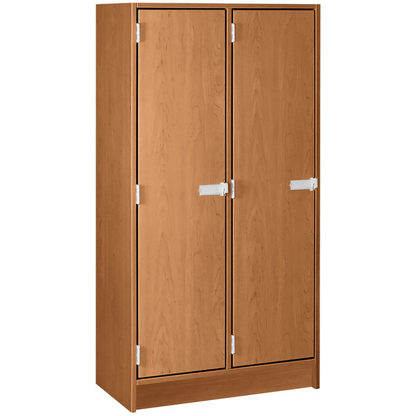 A medium cherry wooden storage locker with two doors.