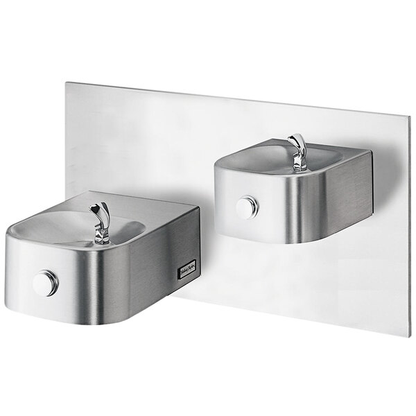 A close-up of a Halsey Taylor stainless steel reverse bi-level wall mount drinking fountain.