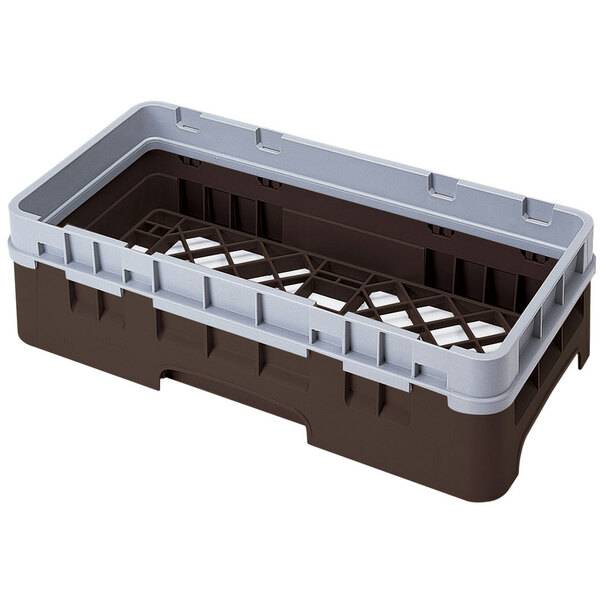 A brown and grey plastic Cambro dish rack with a grey extender.
