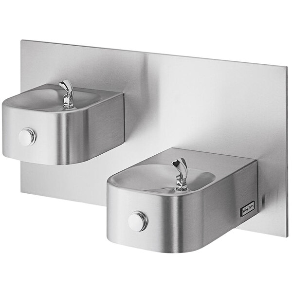 A Halsey Taylor stainless steel bi-level wall mount drinking fountain with two taps.