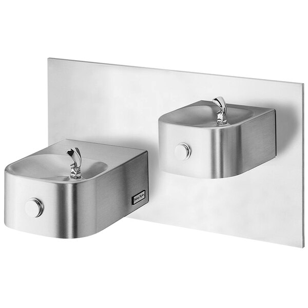 Two stainless steel Halsey Taylor water fountains on a wall.