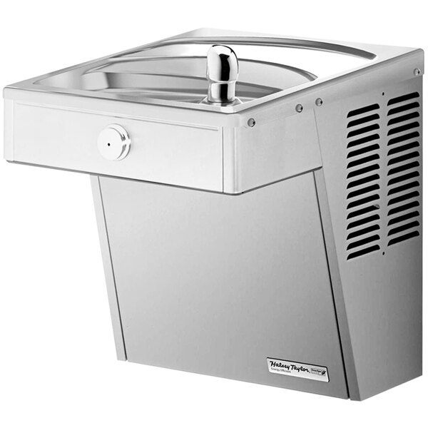 A stainless steel wall mount Halsey Taylor drinking fountain with a water tap.