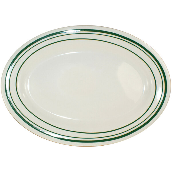 An ivory stoneware platter with green stripes.