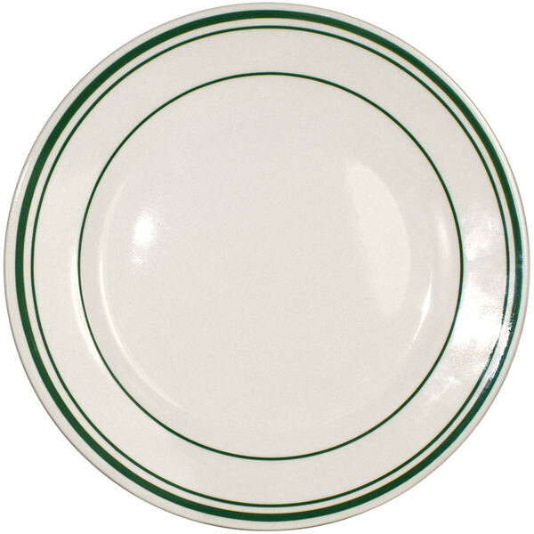 An International Tableware ivory stoneware plate with green lines.