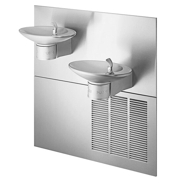 A stainless steel wall mount Halsey Taylor oval contour drinking fountain with two faucets over two white sinks.