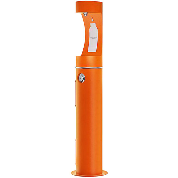 An orange Halsey Taylor water fountain with a round knob.