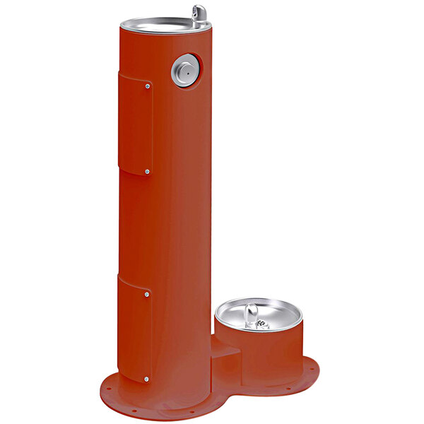 A red terracotta pedestal drinking fountain with stainless steel bowls.