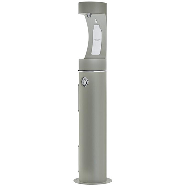 A gray Halsey Taylor water fountain with a white cover.