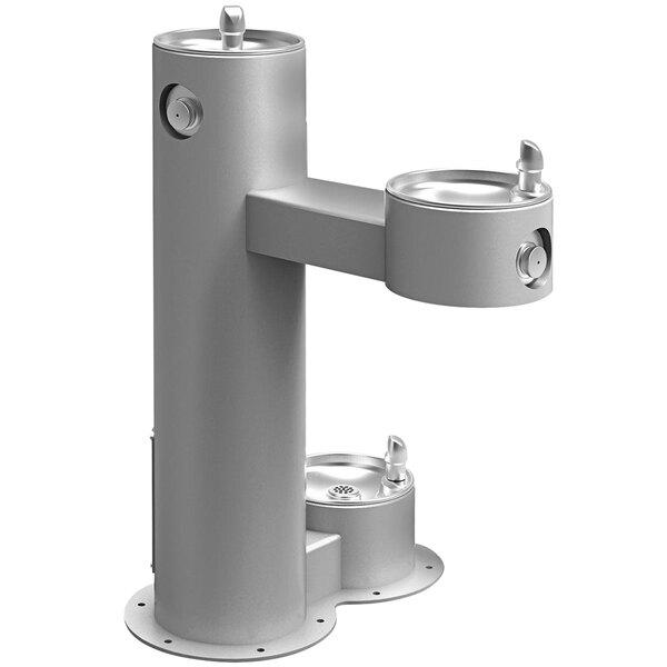 A gray Halsey Taylor outdoor tubular bi-level pedestal drinking fountain with two spouts.