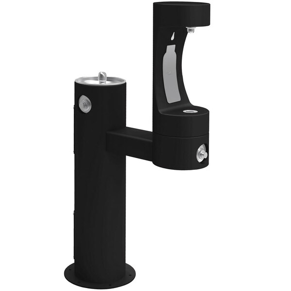 A black Halsey Taylor outdoor pedestal bottle filling station with a lower water fountain.