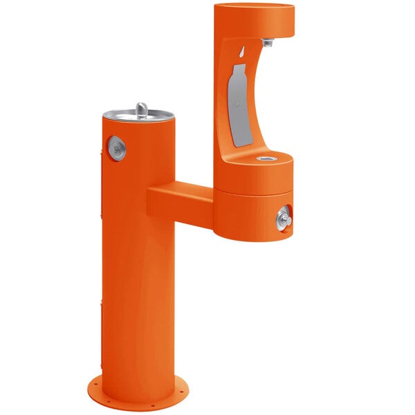 An orange Halsey Taylor water fountain on a metal stand.
