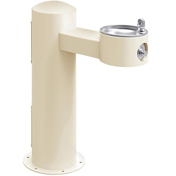 A white drinking fountain with a black and silver handle on a white pedestal.
