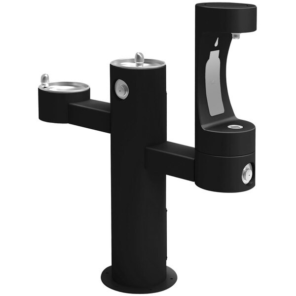 A black Halsey Taylor outdoor pedestal water fountain with two drinking fountains.