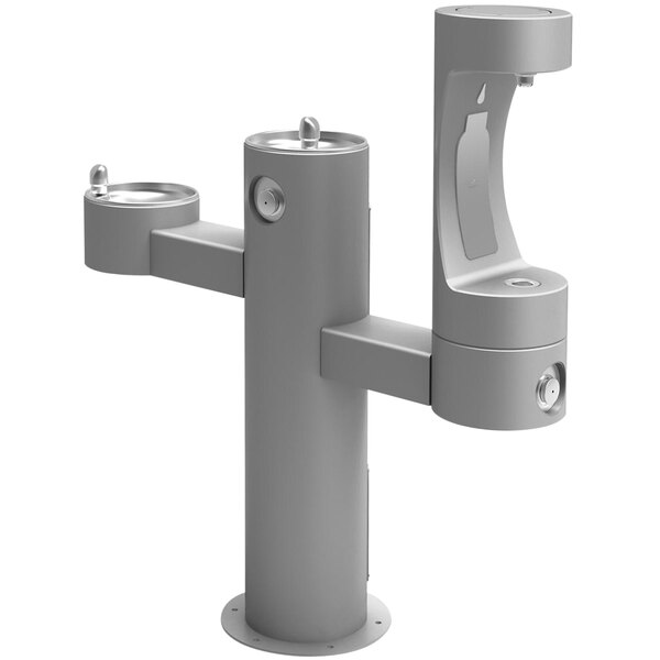 A gray Halsey Taylor outdoor pedestal water fountain with two lower bottle fillers.