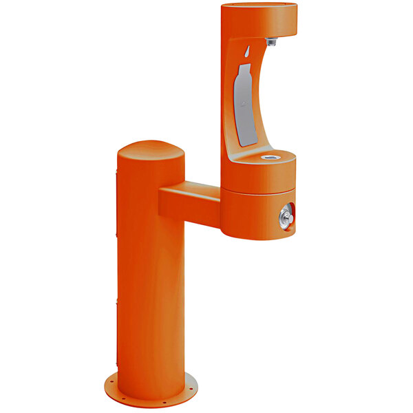 An orange Halsey Taylor water fountain with a silver water dispenser.