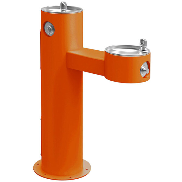 An orange Halsey Taylor outdoor tubular bi-level pedestal drinking fountain with two faucets.