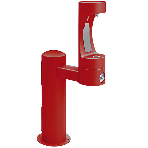 A red Halsey Taylor water fountain with a silver handle and lock.