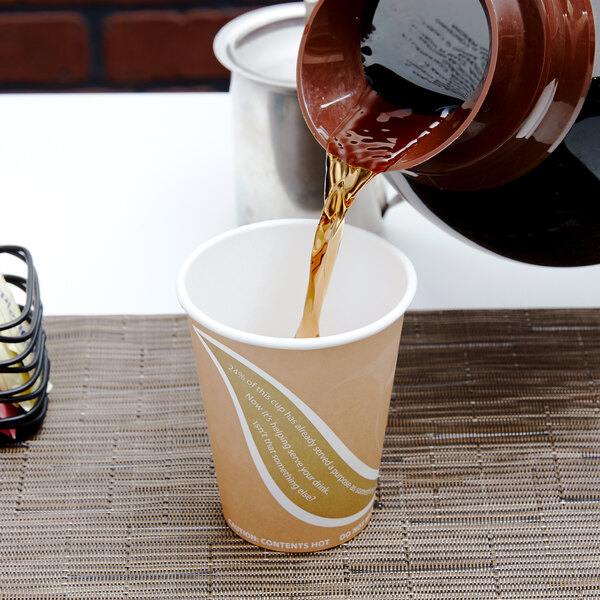 A coffee being poured into an Eco-Products paper cup.