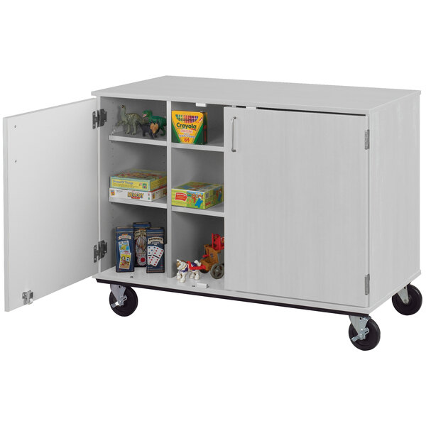 A grey I.D. Systems storage cart with locking doors on wheels.