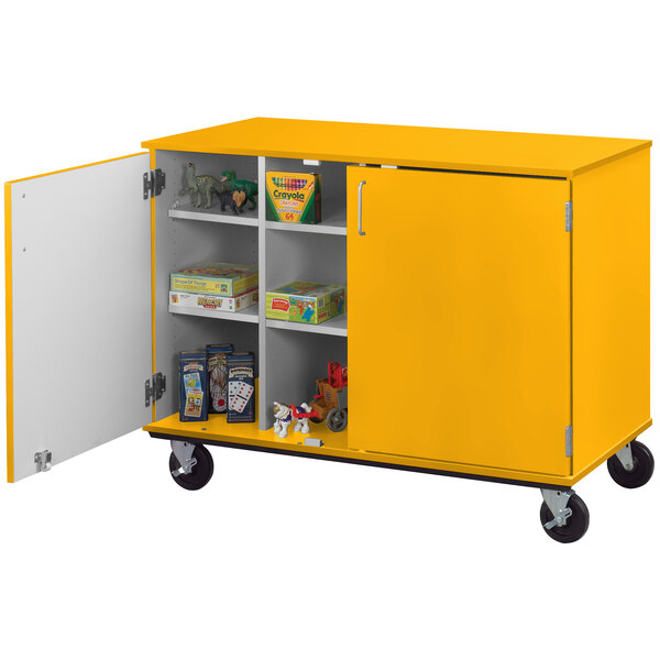 A sun yellow I.D. Systems storage cart with shelves and locking doors on wheels.