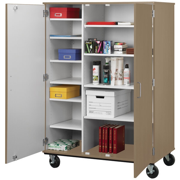 An I.D. Systems tall closed shelf storage cart in a white room filled with books and files.