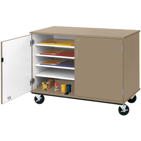 An I.D. Systems slotted storage cart with shelves and a shelf with a door open.
