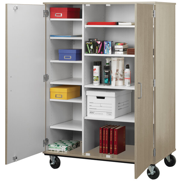 An I.D. Systems white storage cart with shelves and a lock.