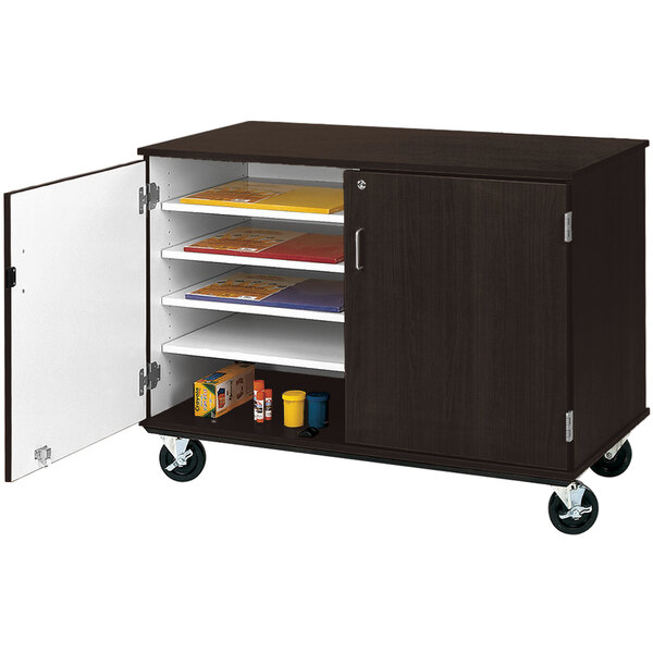 A brown slotted storage cart with a white door.