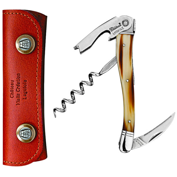 A Chateau Laguiole brown horn waiter's corkscrew in a red leather case with black text.