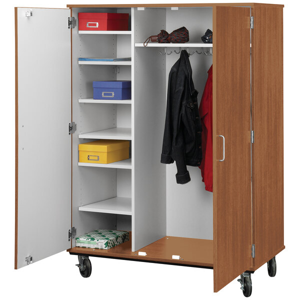 A medium cherry wooden storage cart with shelves and locking doors.