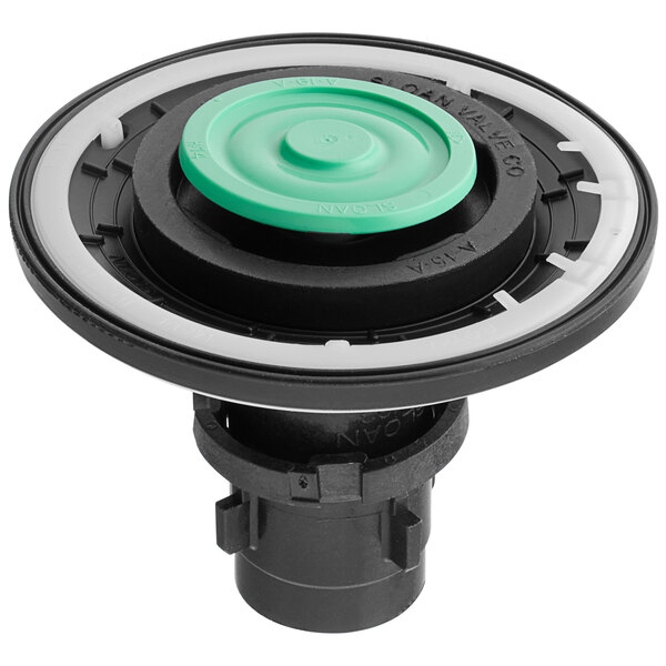 A black and green circular plastic filter.