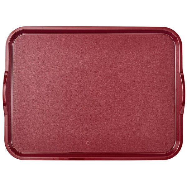A dark cranberry Cambro fast food tray with handles.