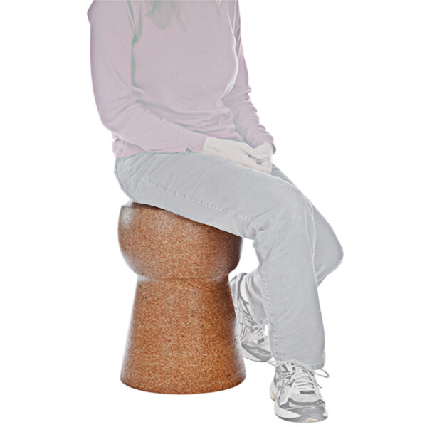 A woman sitting on a Franmara cork stool.