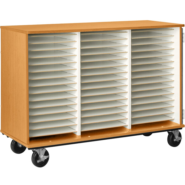 A light oak wooden cart with white shelves and wheels with 51 compartments.